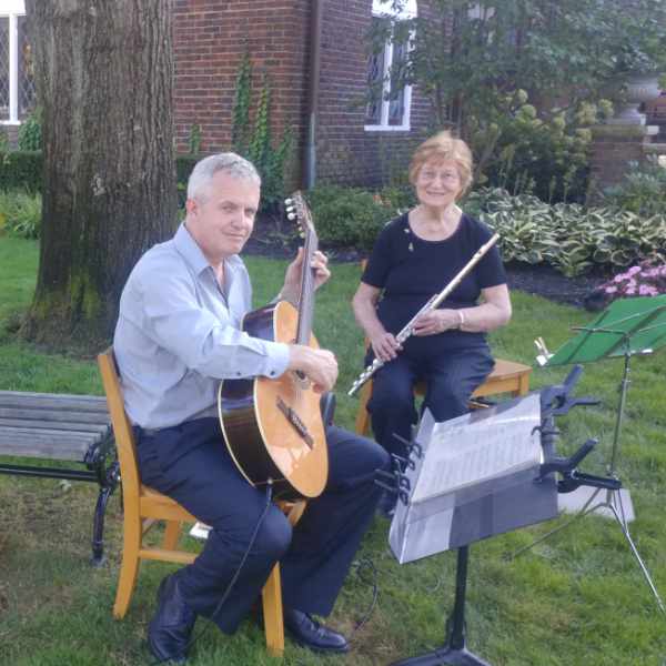 flute and guitar performing